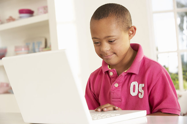 photo of a young student on a laptop
